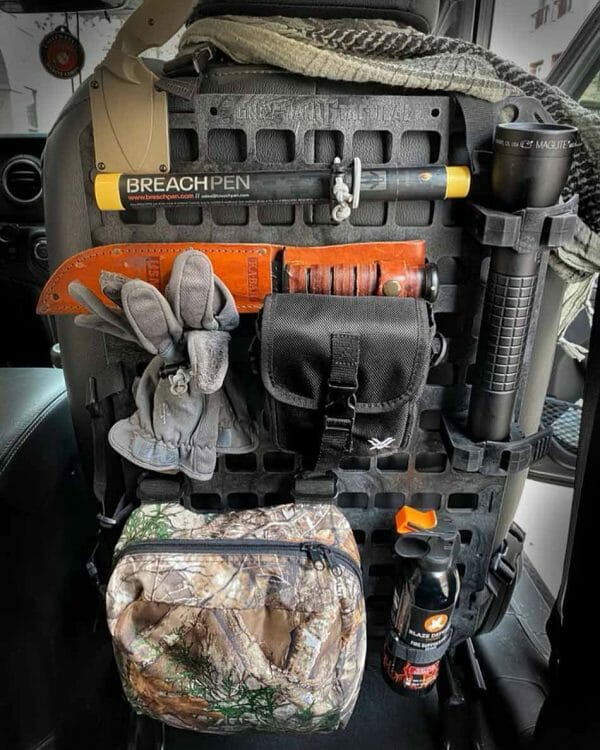 Seat-back-molle-panel-organizer-with-just-gear-on-it being organized